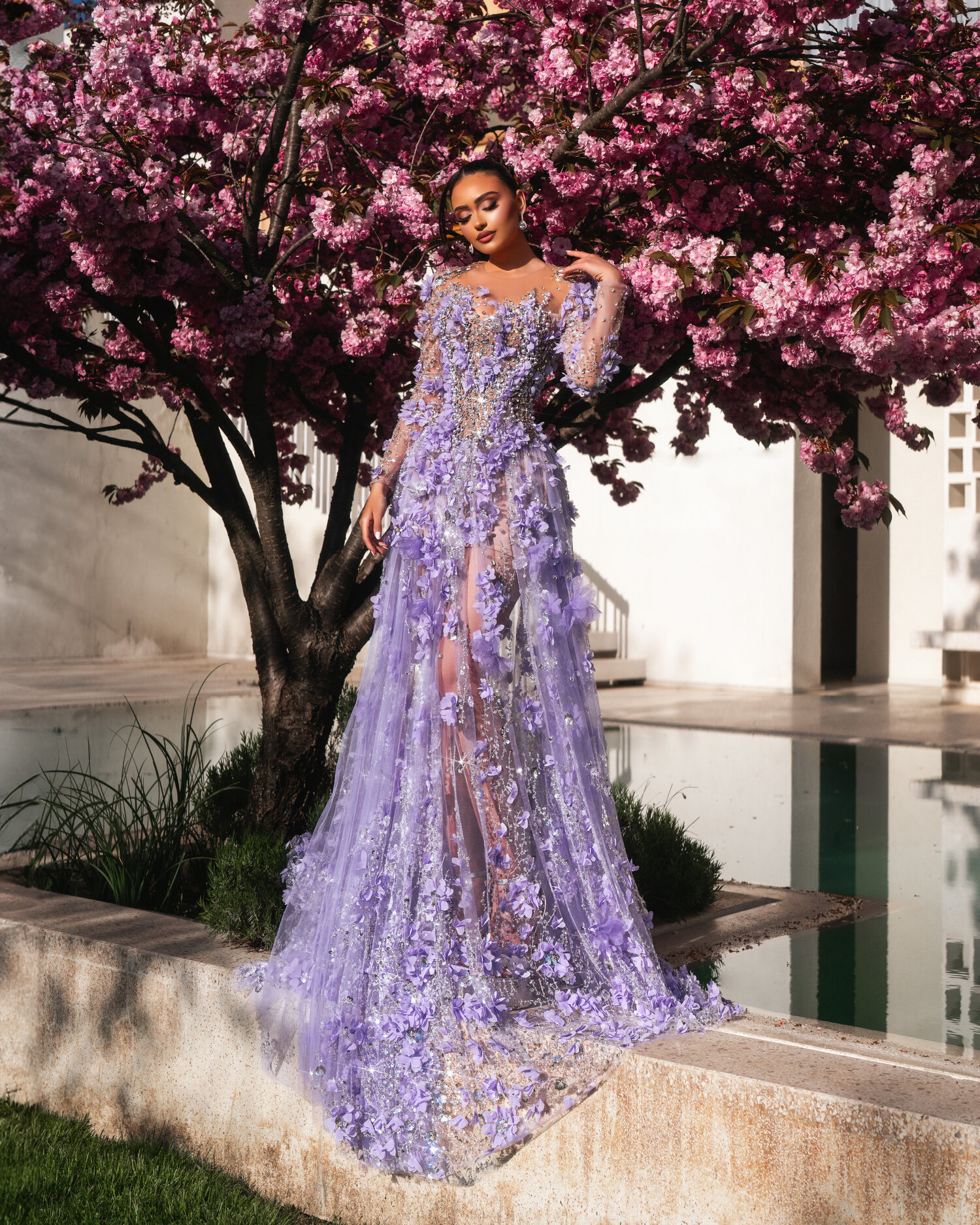 VIRELLA — lavender long-sleeve voluminous gown, full silhouette under cherry blossoms